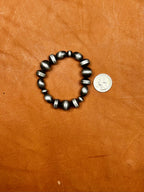 Texas True Trends Amarillo bracelet featuring vibrant yellow beads and adjustable cord for a stylish accessory.