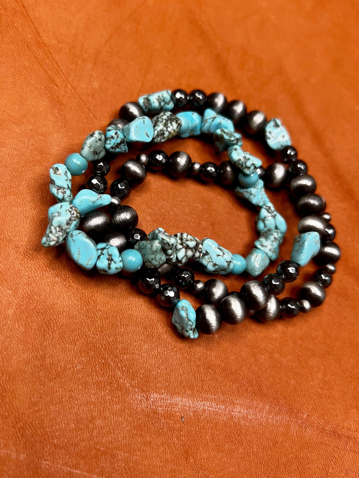 Set of stylish Dallas bracelets by Texas True Trends featuring multiple layered bracelet designs in mixed metals.