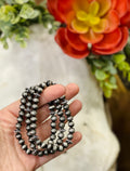 Set of Texas True Trends Pecos bracelets featuring mixed beads and charms, layered for a boho-inspired look.