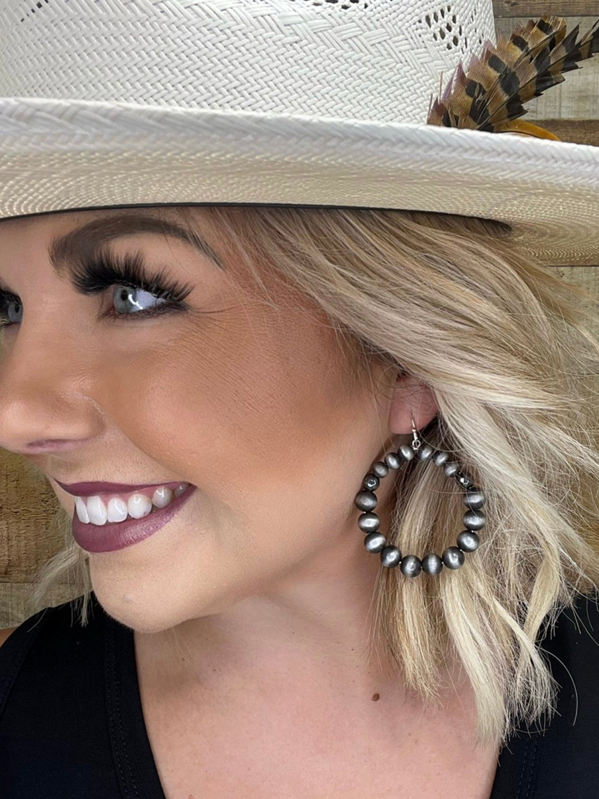 Dallas Earrings by Texas True Trends featuring stylish, silver-toned earrings with intricate design details.
