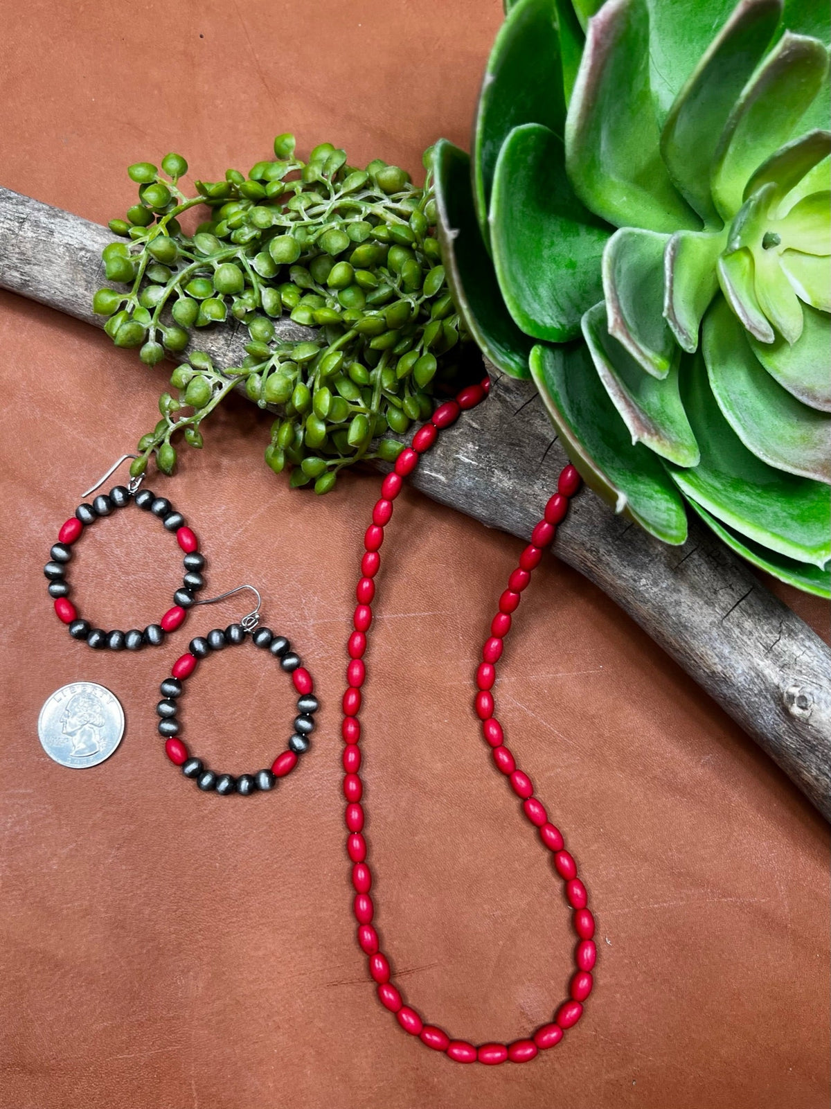 Texas True Trends Lubbock earrings featuring silver hoops with intricate southwestern-inspired designs.