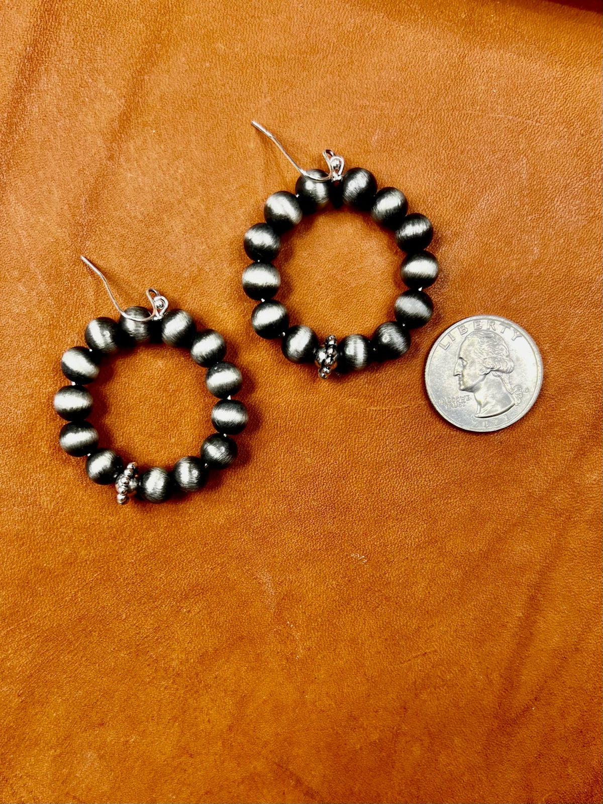 Texas True Trends Pecos Earrings featuring Southwestern-inspired design with silver and turquoise accents.