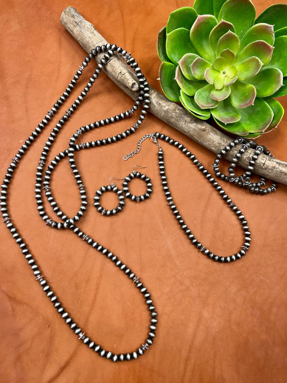 Texas True Trends Pecos Earrings, stylish silver hoop earrings with intricate southwestern design, for a boho-chic look.