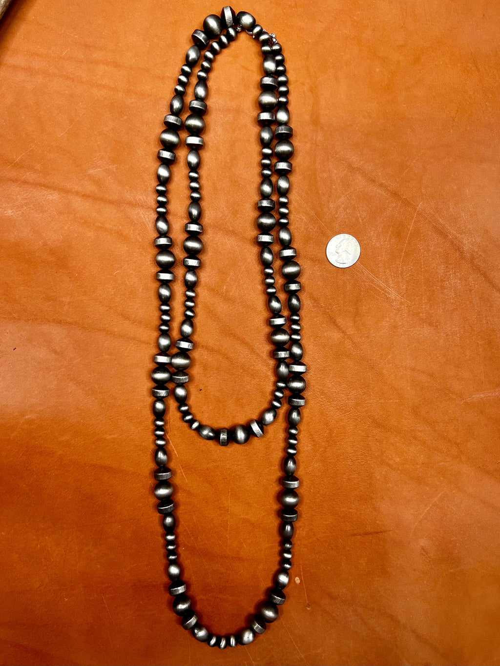Texas True Trends Amarillo Long Necklace featuring a stylish, elongated design with intricate beadwork and vibrant yellow accents.
