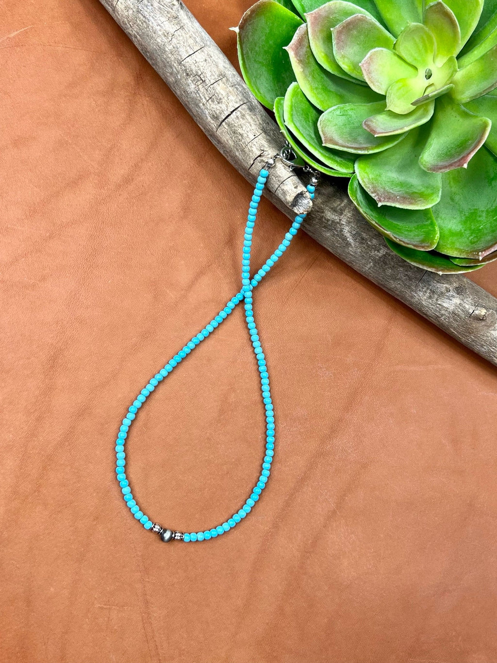 Texas True Trends Crockett Necklace, stylish silver jewelry with intricate design, featuring a pendant on a matching chain.