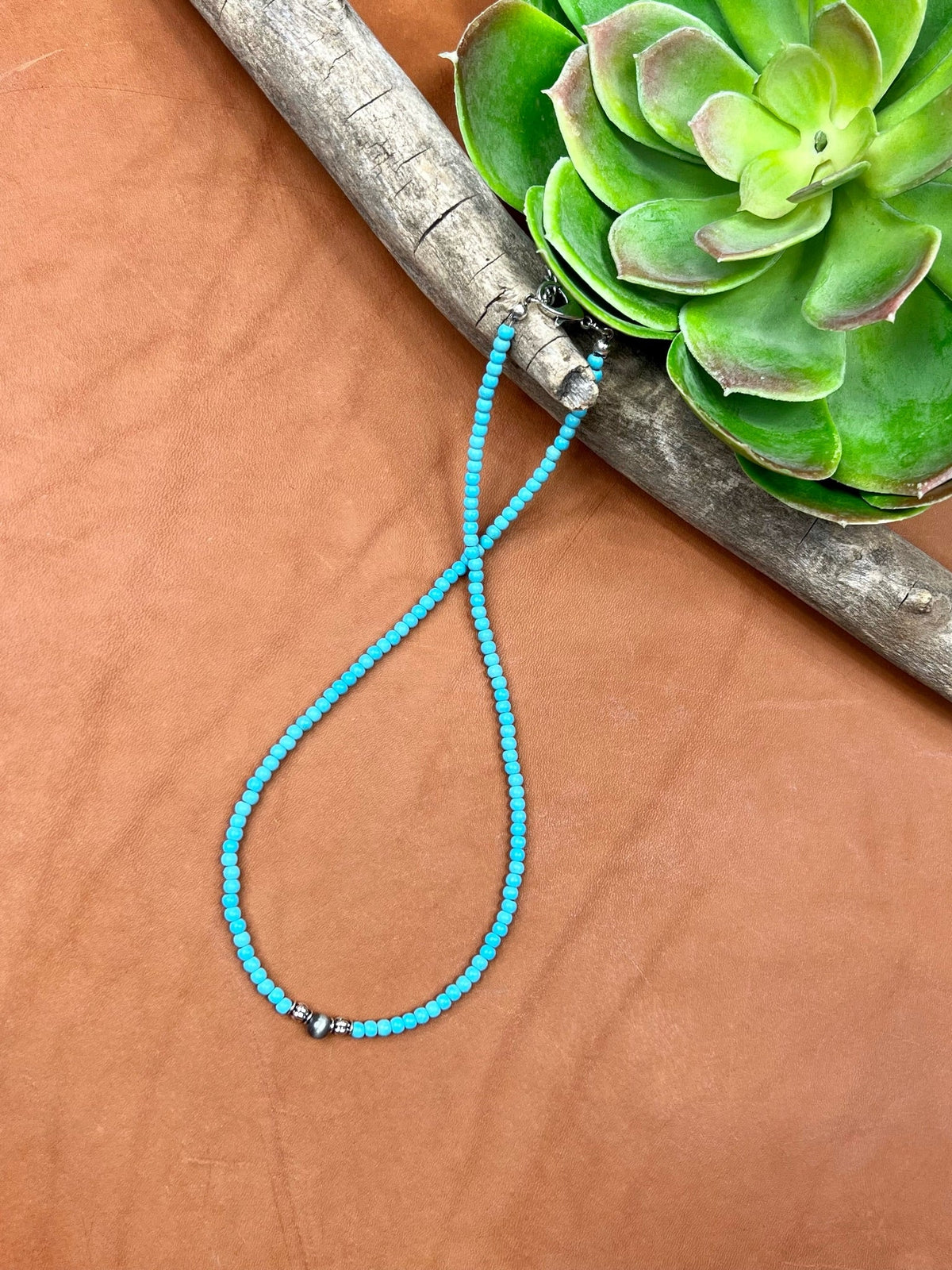 Texas True Trends Crockett Necklace, stylish silver jewelry with intricate design, featuring a pendant on a matching chain.