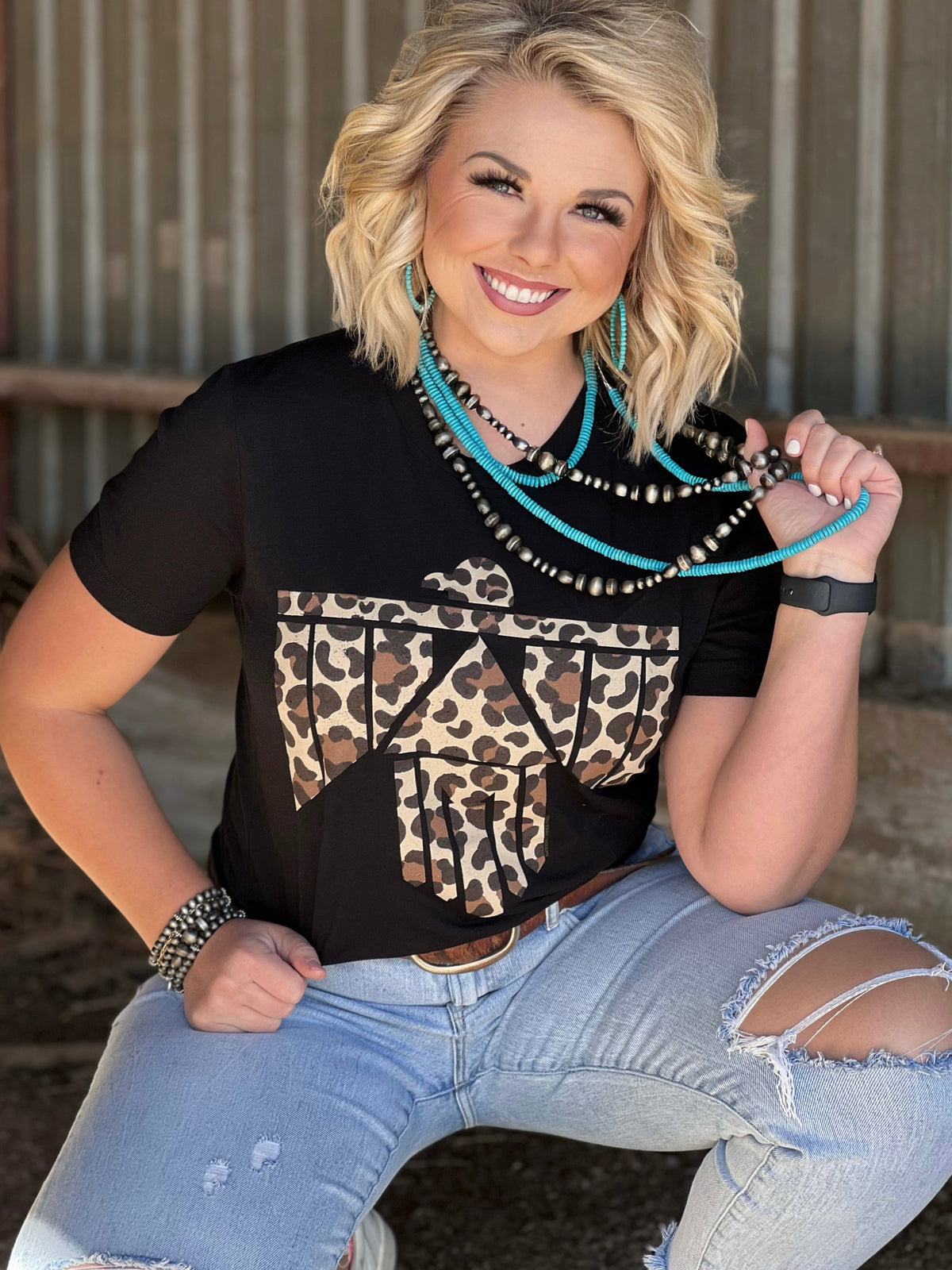 Texas True Trends Fort Worth Long Necklace featuring layered gold-tone chains and intricate pendant detailing.