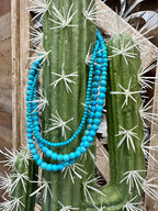 Turquoise Spearman necklace by Texas True Trends featuring a vibrant, beaded design with a silver clasp.