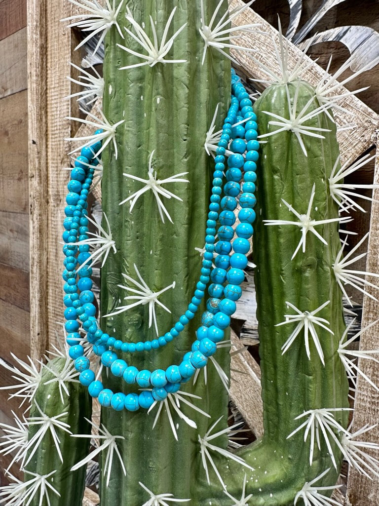 Turquoise Spearman necklace by Texas True Trends featuring a vibrant, beaded design with a silver clasp.