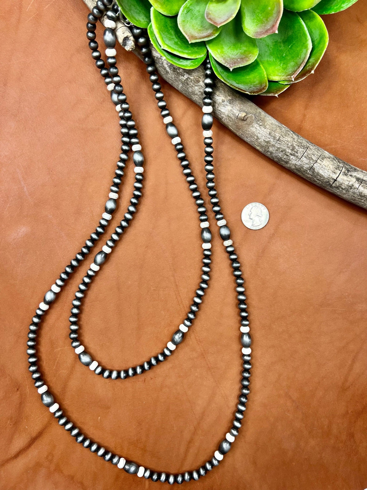 Whitesboro Necklace by Texas True Trends featuring a stylish gold-toned pendant on a delicate chain.