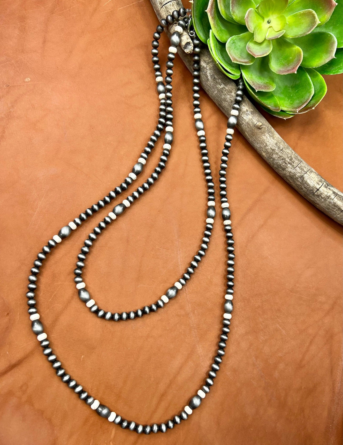 Whitesboro Necklace by Texas True Trends, a stylish jewelry piece with intricate design, featuring silver tones and detailed craftsmanship.