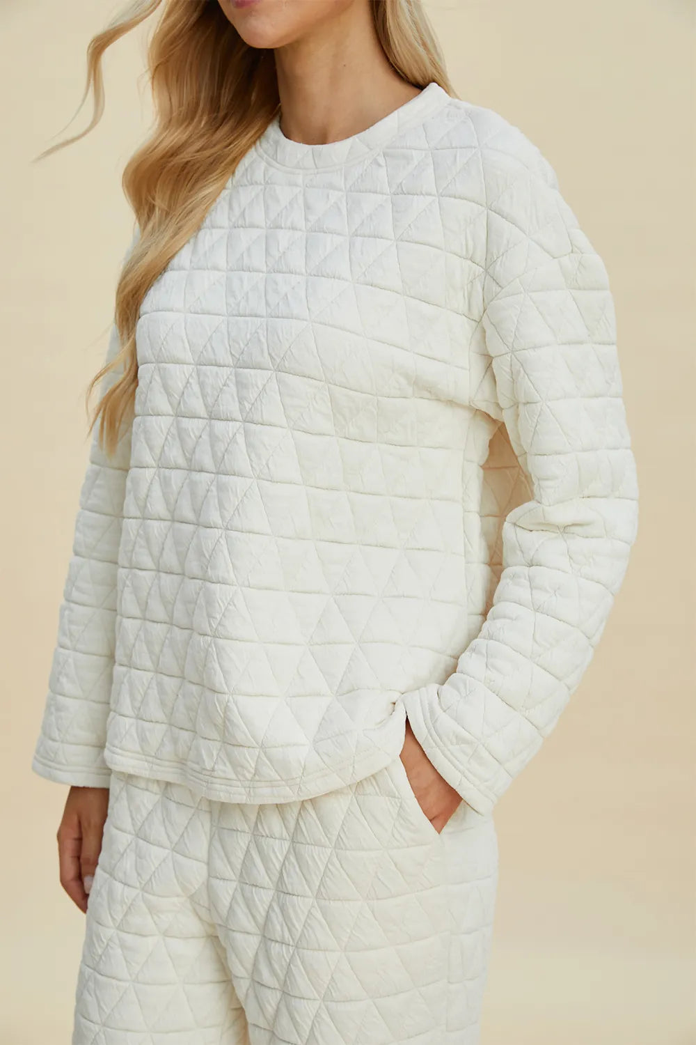 Beige Trendsi Double Take full-size textured round neck long sleeve top paired with matching pants, casual and comfortable outfit.