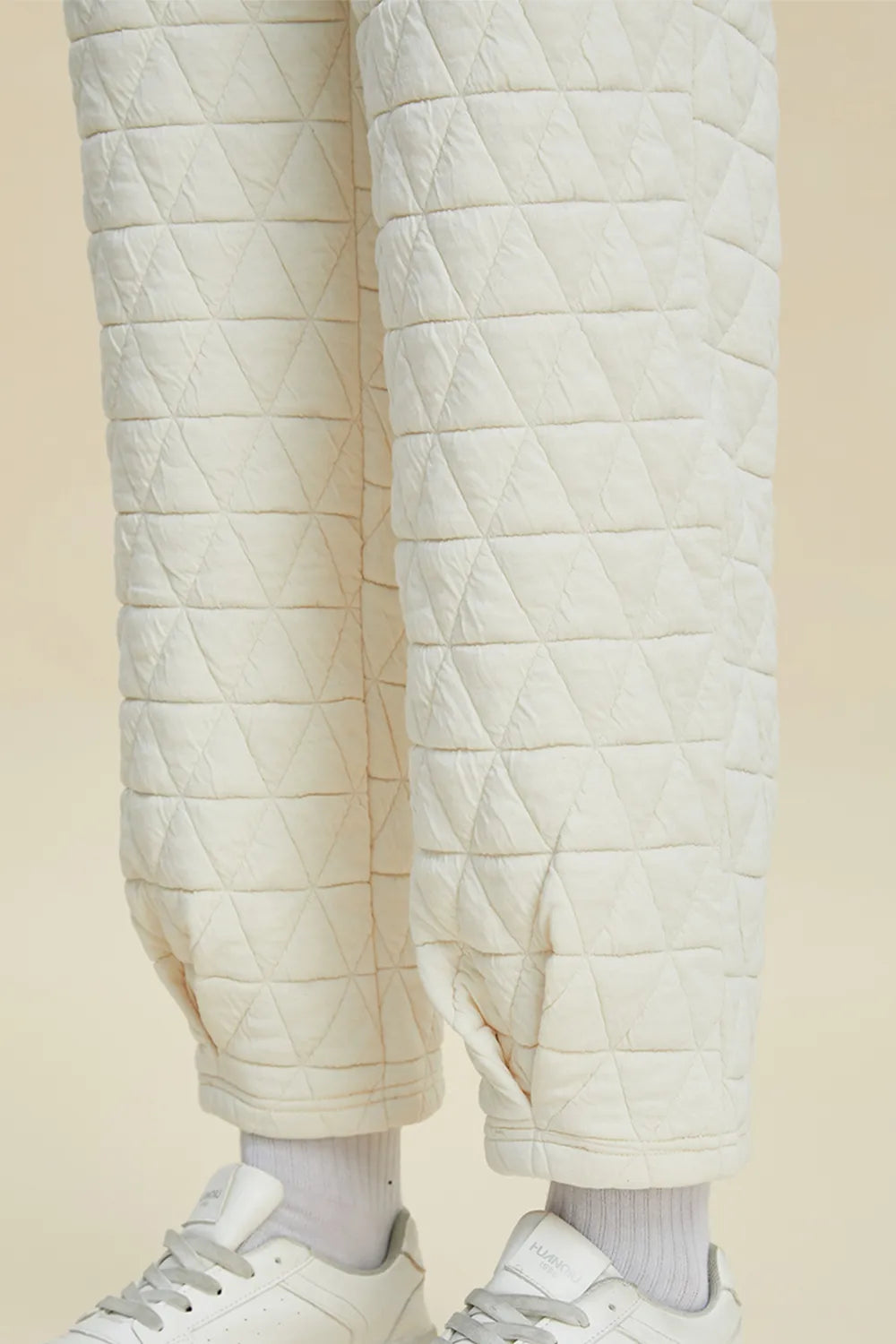 Beige textured long sleeve top and pants set by Trendsi, featuring a round neck and full-size fit.