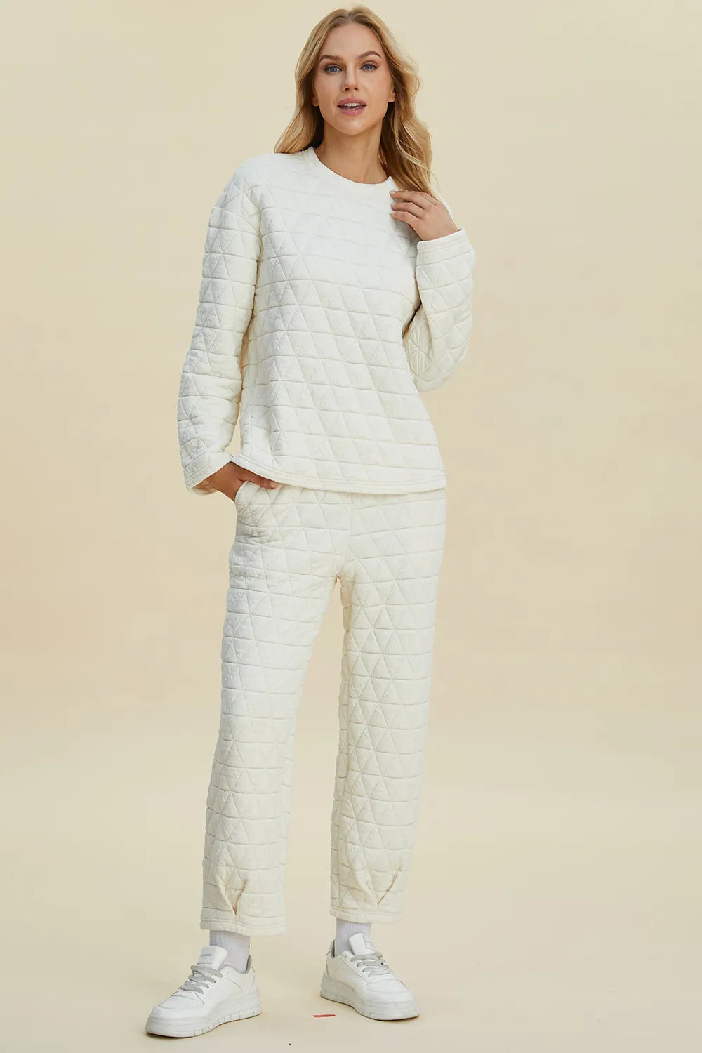 Beige Trendsi Double Take full-size textured round neck long sleeve top and matching pants set, casual loungewear ensemble.