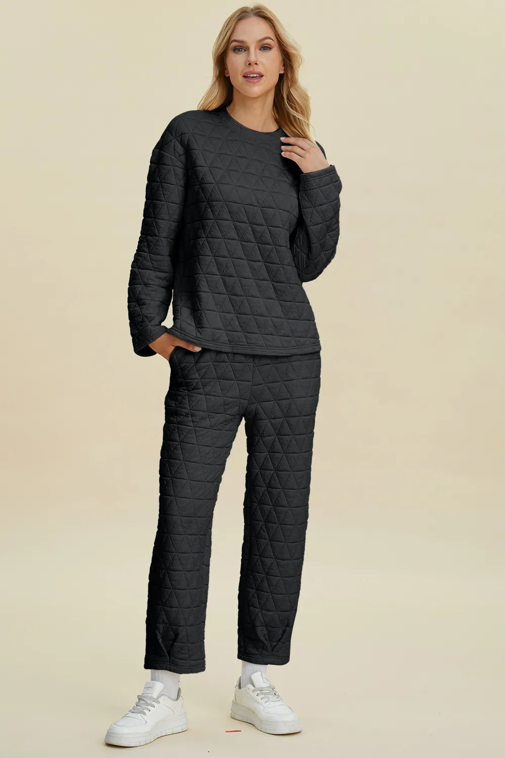 Beige double take full size textured round neck long sleeve top and matching pants set by Trendsi, shown on a model.