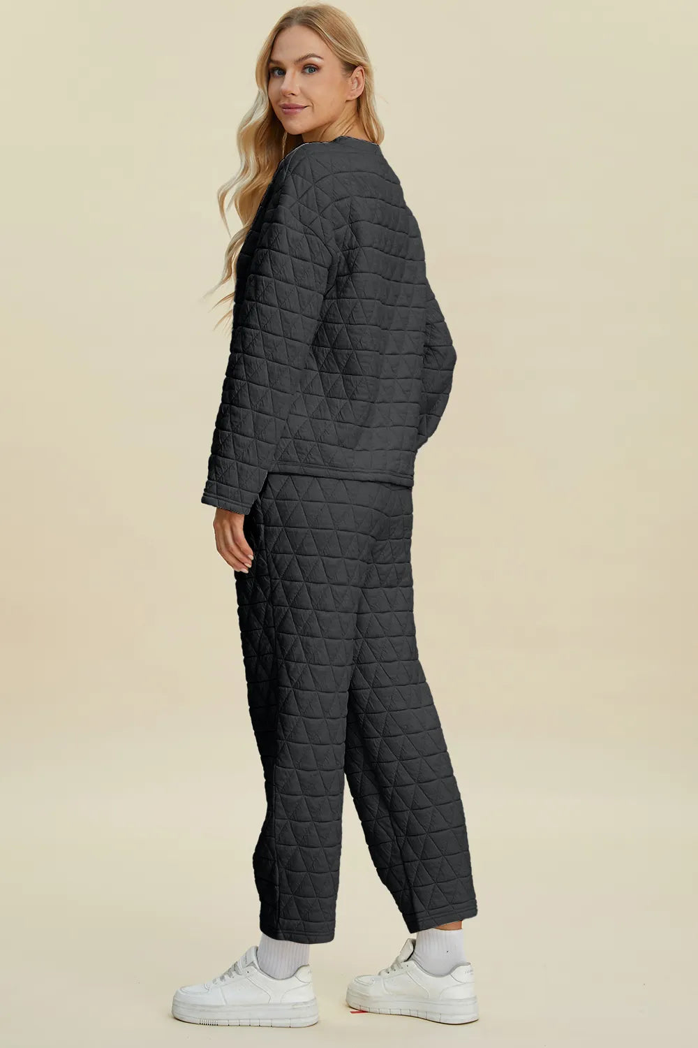 Beige textured pants from Trendsi's Double Take full-size set, featuring a round neck long sleeve top and matching pants.