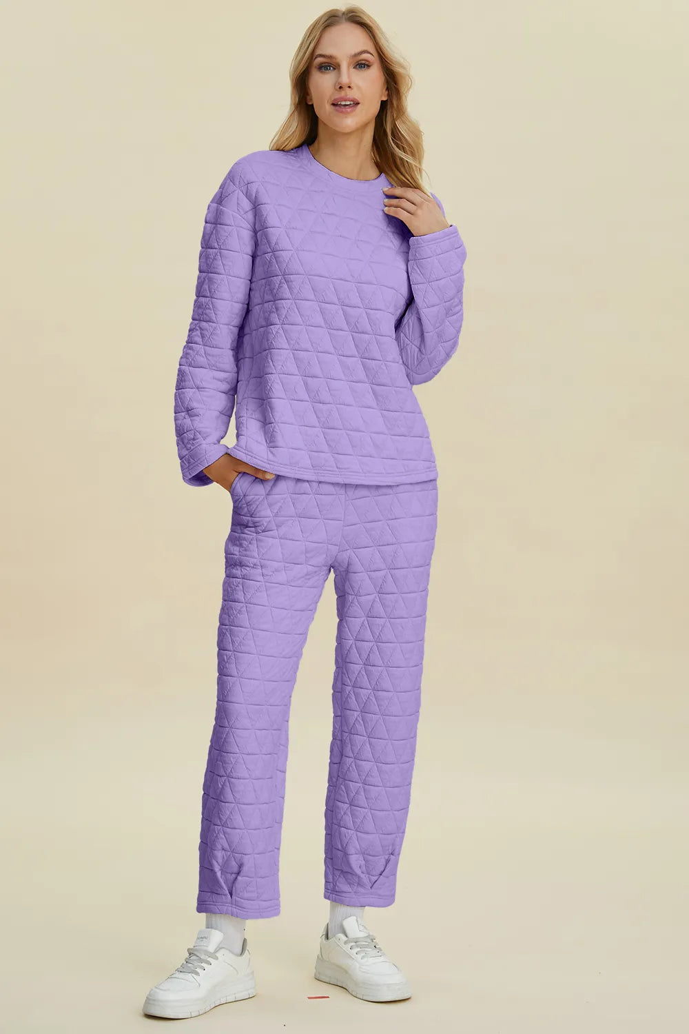 Beige double take full-size texture round neck long sleeve top and matching pants set by Trendsi, featuring a comfortable, stylish design.