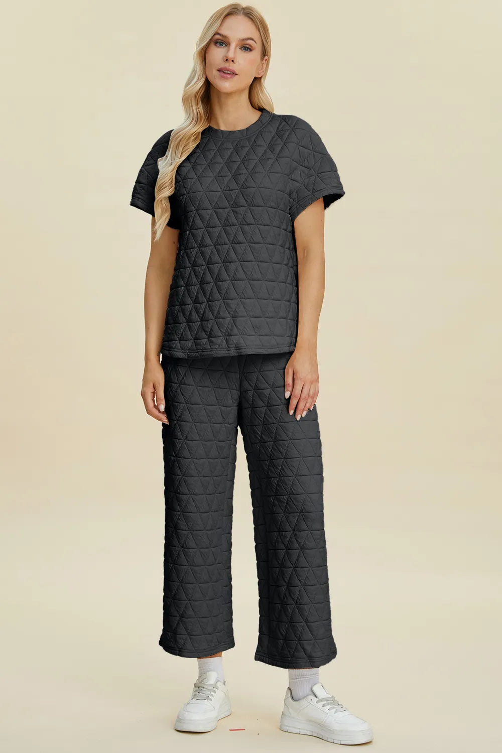 Black double take full-size texture round neck short sleeve top and matching pants set, trendy two-piece outfit by Trendsi.