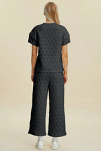 Black Trendsi double take full-size texture round neck short sleeve top and matching pants two-piece set, casual and comfortable.