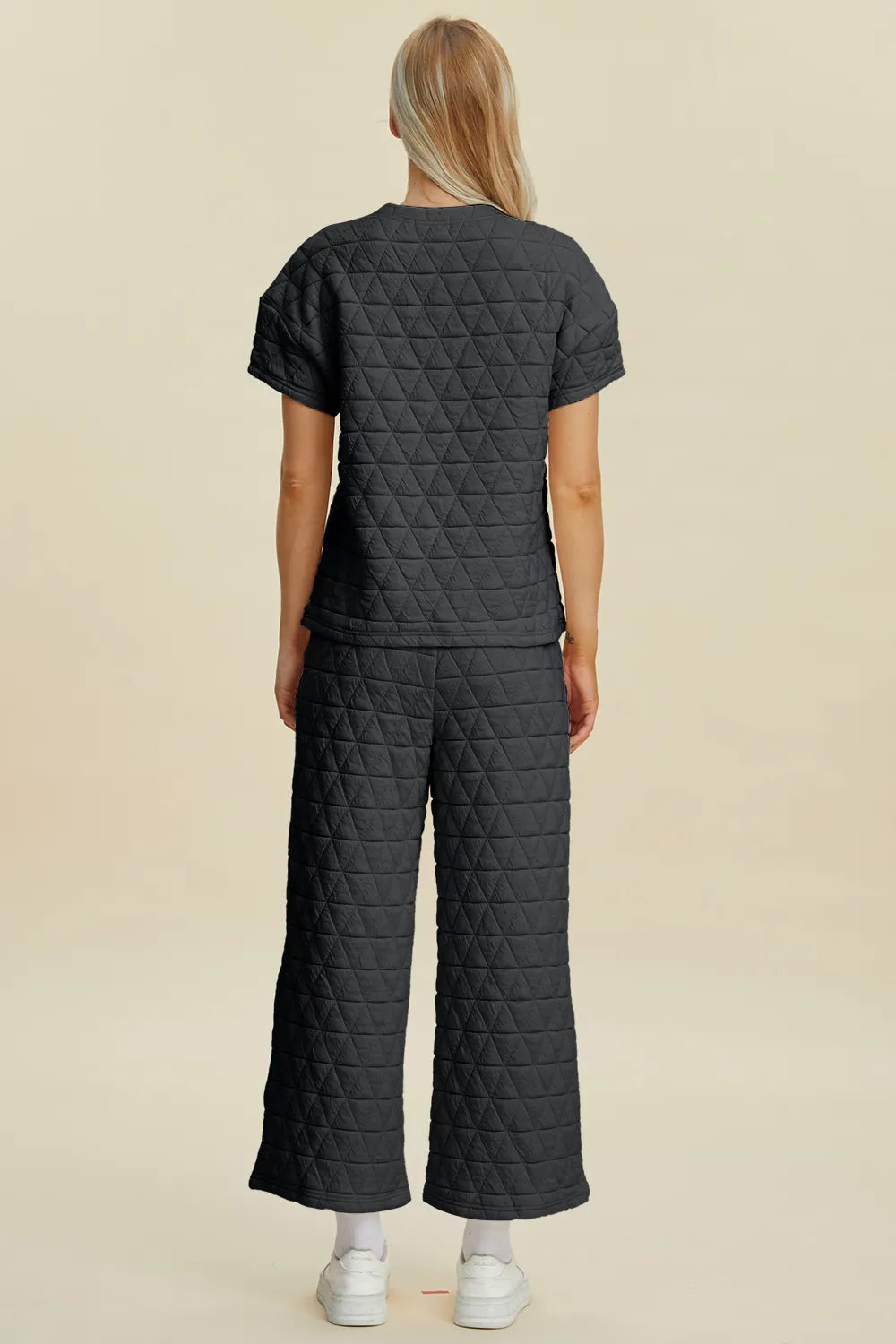 Black Trendsi double take full-size texture round neck short sleeve top and matching pants two-piece set, casual and comfortable.
