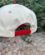 Crimson "Never Lost A Tailgate" hat by Wicker Road featuring a curved brim and embroidered design for outdoor events and tailgates.