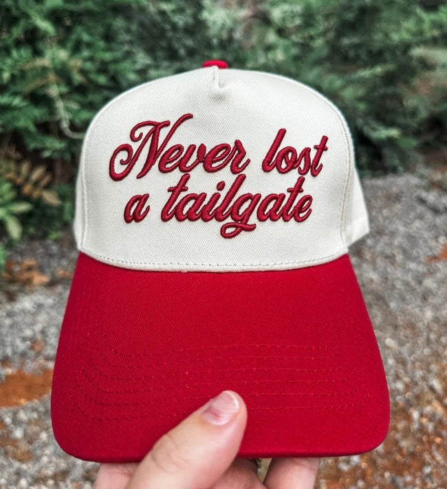 Crimson Wicker Road Never Lost A Tailgate hat with embroidered logo, casual cap for outdoor events and tailgating.